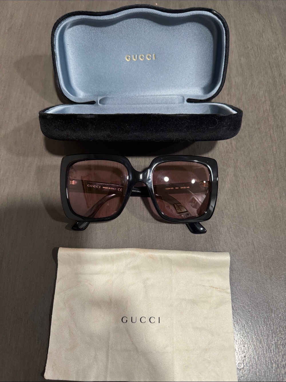 Gucci Women’s Black Frame Sunglasses with Brown Lenses
